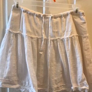 white skirt haslace look on bottom and ties at top